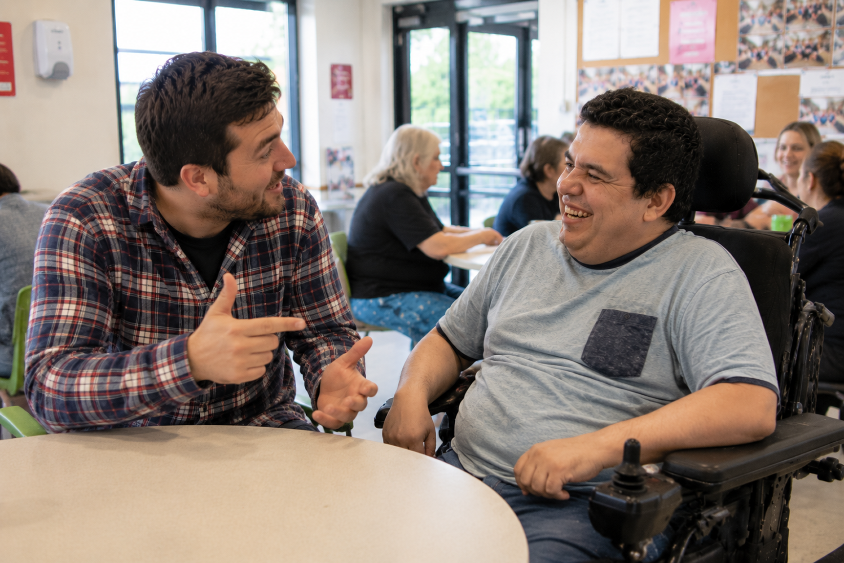 Participant and support worker engaged in meaningful community activity