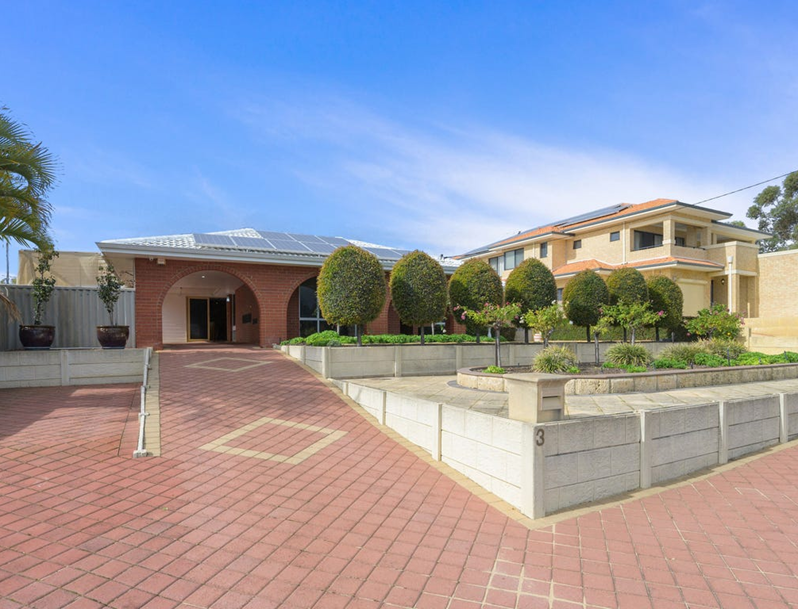 Exterior of a supported living home with a garden